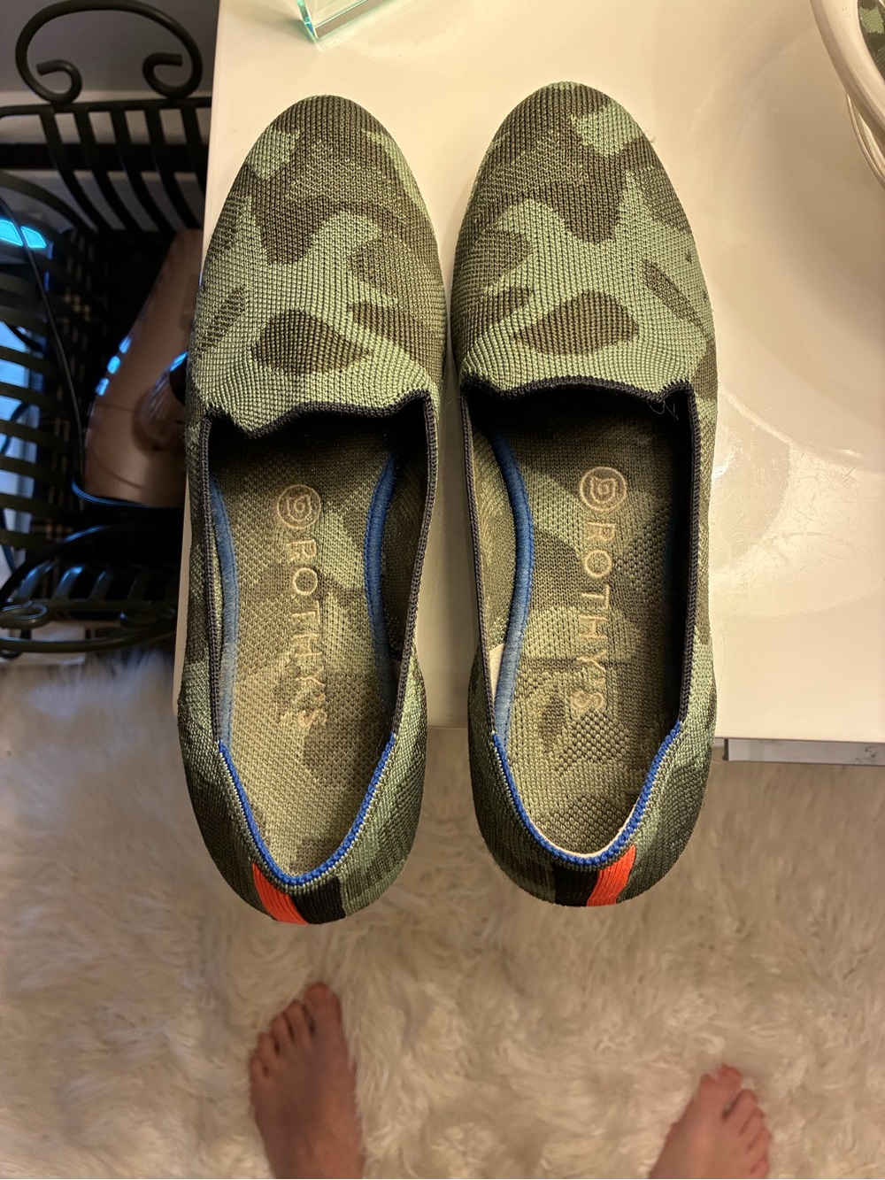 Rothy's Kids Olive Camo Slip-Ons with Blue Trim and Orange Heel Tab